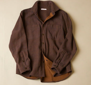 Brown shirt with a textured finish on a beige background