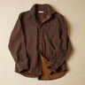 Brown shirt with a textured finish on a beige background
