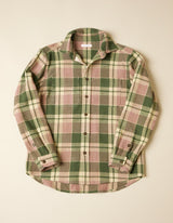 Green and pink plaid shirt on a beige background