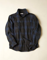 Blue black plaid shirt on a beige background