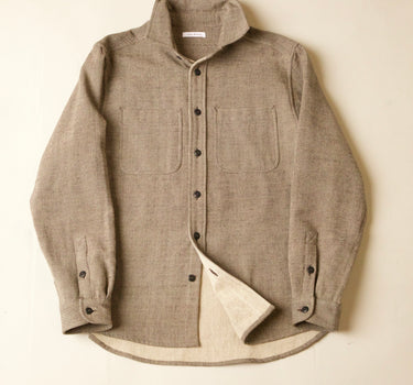 Grrey button-up shirt with a natural lining on a beige background