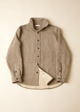 Grrey button-up shirt with a natural lining on a beige background