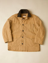 Beige jacket with black collar and buttons on a beige background