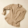 Beige striped shirt on a beige background