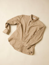Beige striped shirt on a beige background