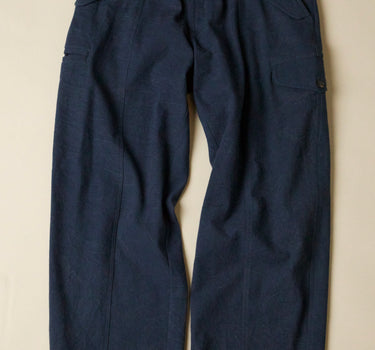 Pair of dark navy blue pants on a beige background