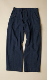 Pair of dark navy blue pants on a beige background