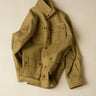 Khaki field jacket on a beige background