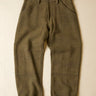 Pair of olive green pants on a beige background