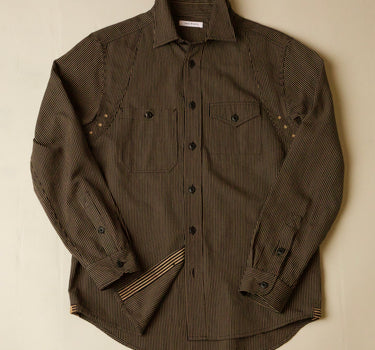 Brown subtle stripe shirt on a beige background