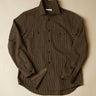 Brown subtle stripe shirt on a beige background