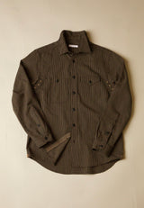 Brown subtle stripe shirt on a beige background