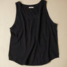 Black tank top on a beige background