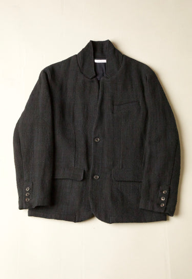 Dark gray jacket on a light beige background