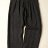 Black pants on a beige background