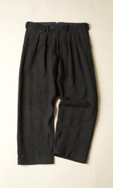 Black pants on a beige background