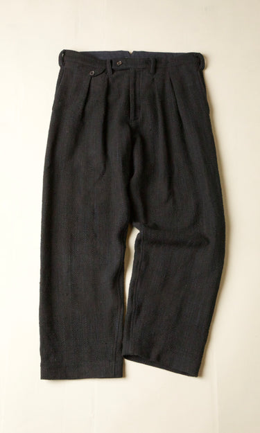 Black pants on a beige background