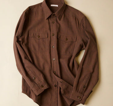 Brown shirt on a beige background