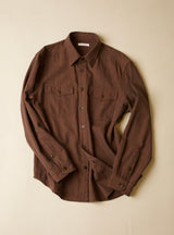 Brown shirt on a beige background