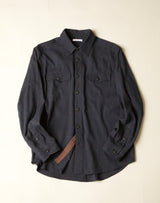 Dark gray blue shirt on a beige background