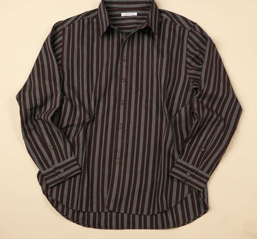 Longsleeve plum and indigo striped shirt on a beige background