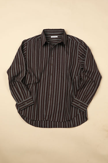 Longsleeve plum and indigo striped shirt on a beige background