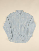 Light blue and natural long sleeve shirt on beige background
