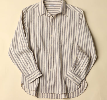 Natural and plum striped shirt on a beige background