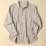 Natural and plum striped shirt on a beige background