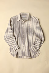 Natural and plum striped shirt on a beige background