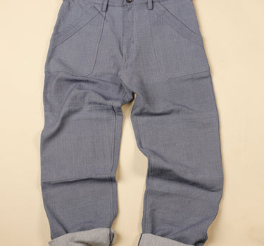 Ligh blue gray pants on a beige background