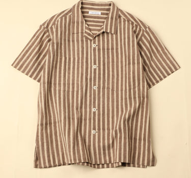 Flat brown and white striped shirt on a beige background