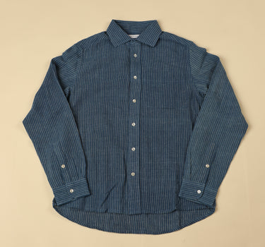 Blue striped shirt on a beige background