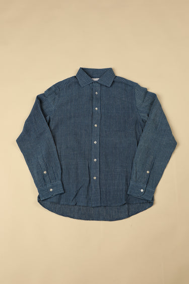 Blue striped shirt on a beige background