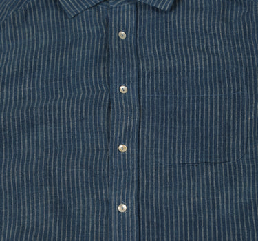 Blue striped shirt with collar and buttons on a beige background