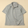 Flat light blue shirt on a beige background