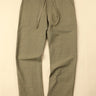 Green pants on a beige background
