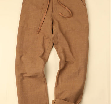 Brown pants on a beige background