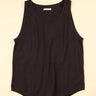 Plum sleeveless shirt on a beige background