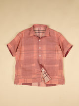 Pink double gauze shirt with plaid lining on a beige background 