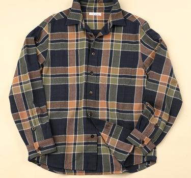 Plaid shirt on a beige background