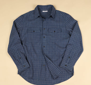 Blue checkered shirt on a beige background
