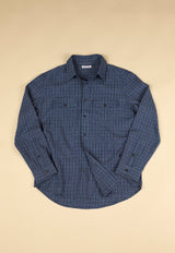 Blue checkered shirt on a beige background