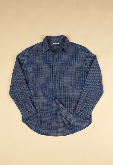 Blue checkered shirt on a beige background