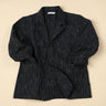 Dark blue pinstripe blazer on a beige background