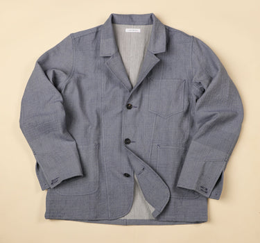 Light Blue handwoven jacket on a beige background