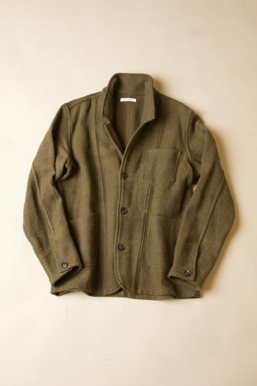 An olive green wool-blend work jacket with a button-up front, laid flat against a light beige background.